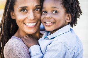 Portrait of family couple mother and son black afro